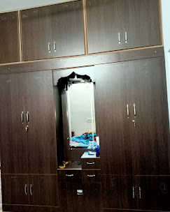 Full-height executive wardrobe system with dressing nook and full-length mirror — interior design Dindigul